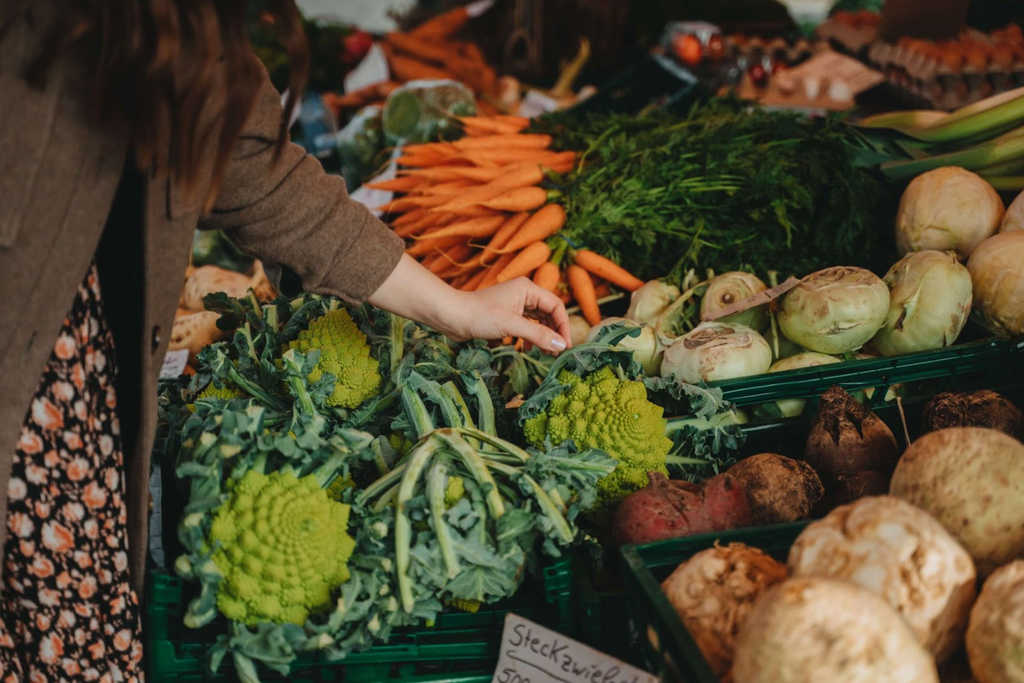 Farmers Market Product with a woman grabbing some