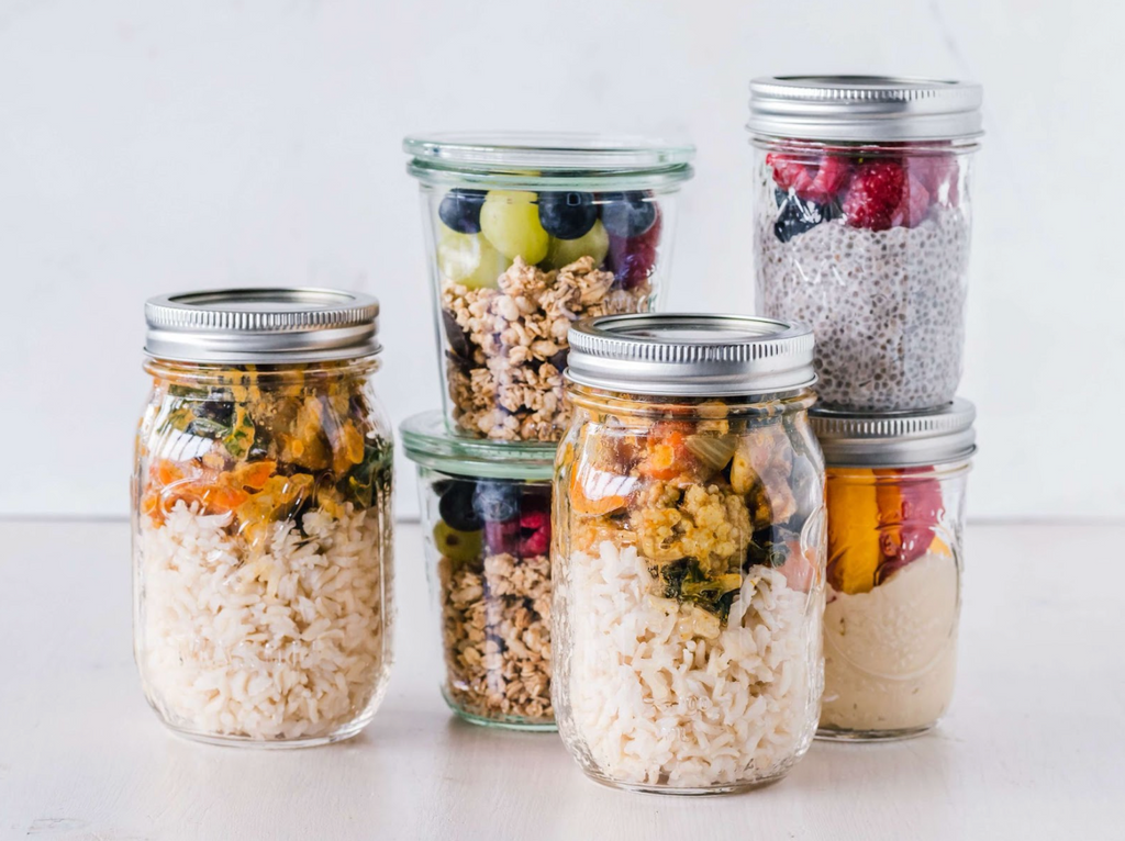 Jars full of a variety of chia pudding for weekly healthy meal prep