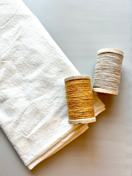 flour sack towel with wool thread spool