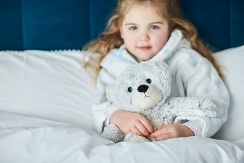 Little girl with Warmies Marshmallow Bear