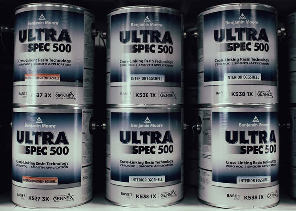 Cans of Ultra Spec 500 paint on display in a Benjamin Moore paint store