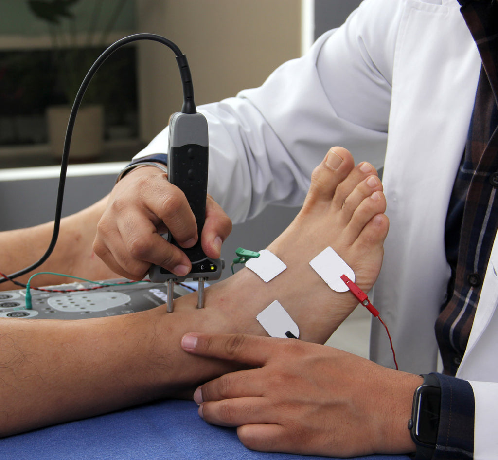 doctor performing electromyography