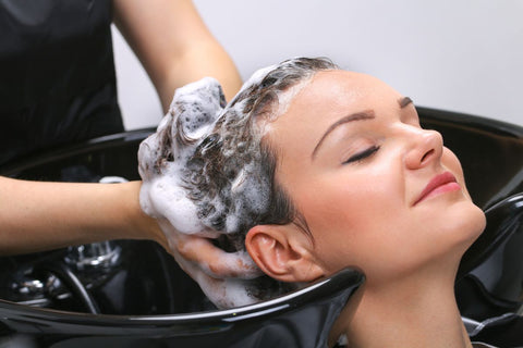 Woman getting curly hair washed by the Curly Life Company