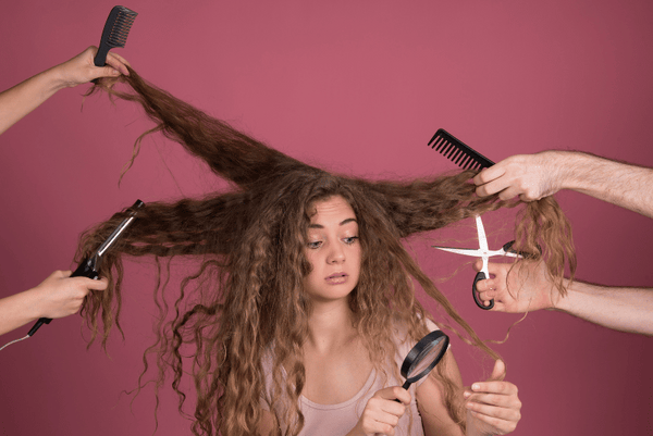 Curly Hair Problems showing a curly haird woman with scissors, flat iron, brush getting stuck in hair