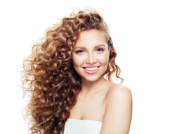 woman with beautiful curly hair smiling