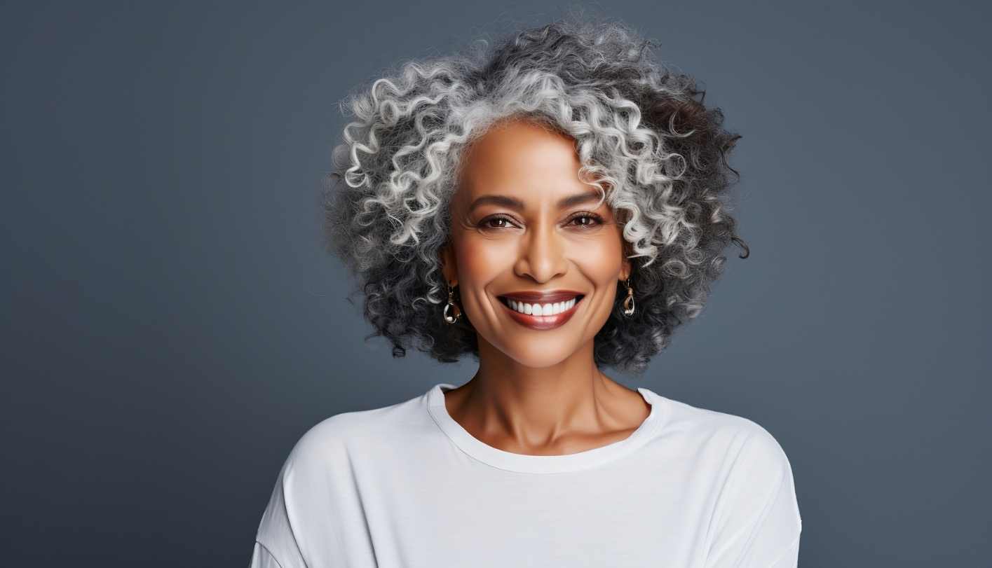 Elegant African American woman with curly salt and pepper hair