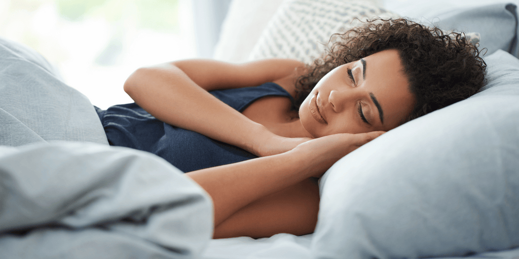 Gorgeous Women with Curly Hair a sleep on pillow