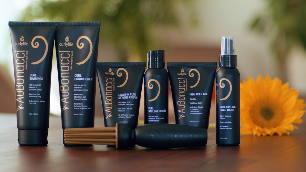 AuBonacci Curl Hair Care Product Line displayed on the table with sunflower