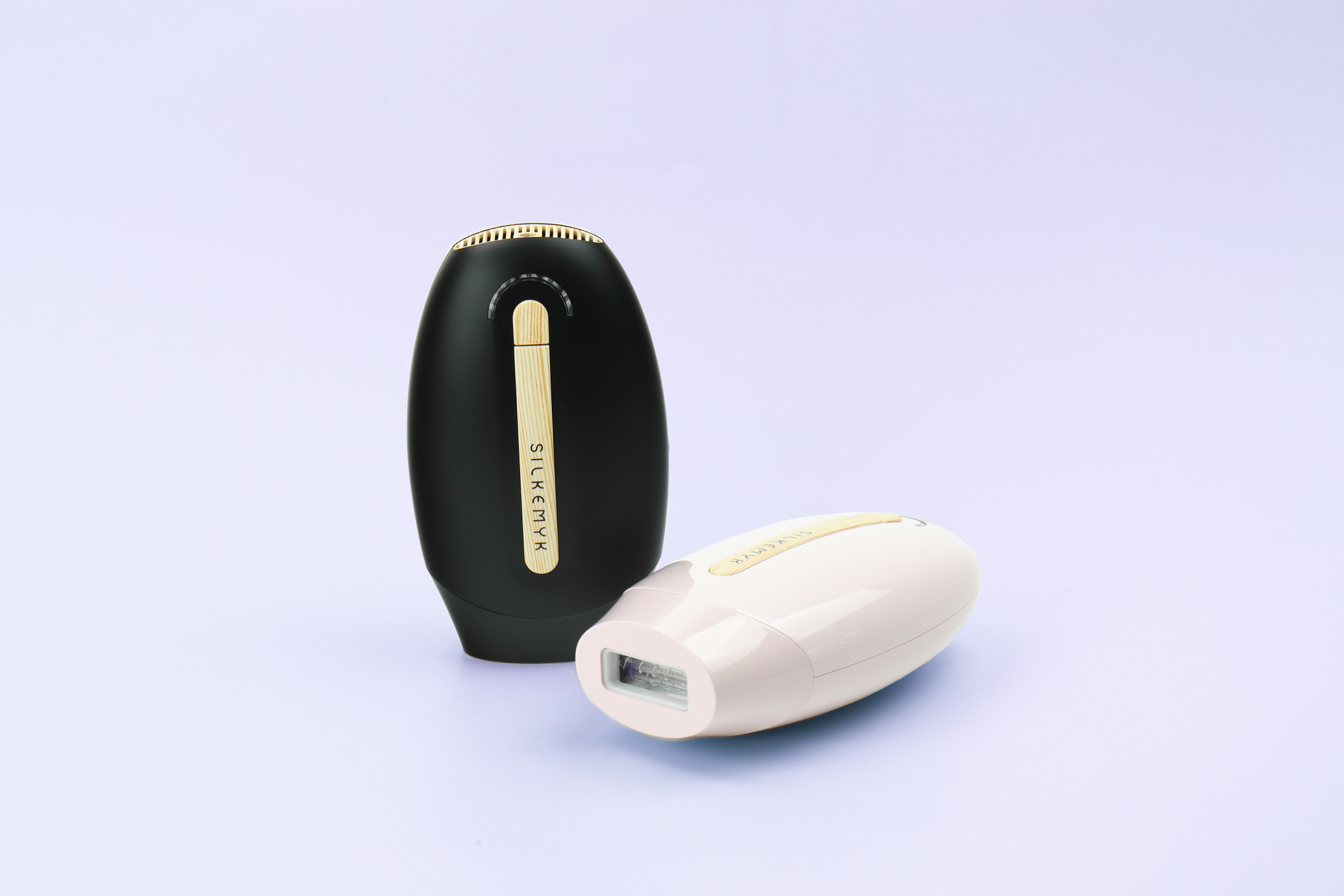Silkemy IPL hair remover in two different variants on a purple background