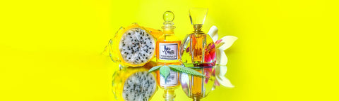 Nakie Coquette Face Oil Gift Set Bright Yellow Background With Passion Fruit and Flowers