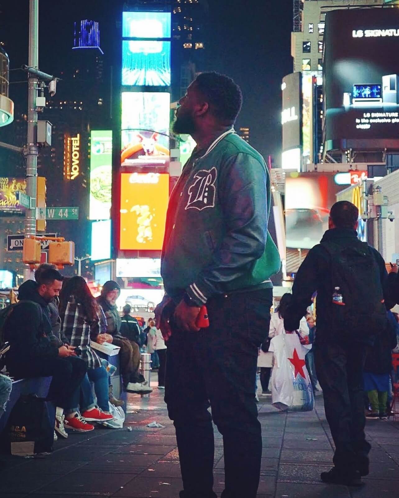 guy standing in the street looking up