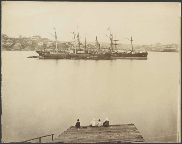 Four people sitting on a dock, looking towards ships in the harbour and Millers Point, Sydney, ca. 1875 https://nla.gov.au:443/tarkine/nla.obj-148002284