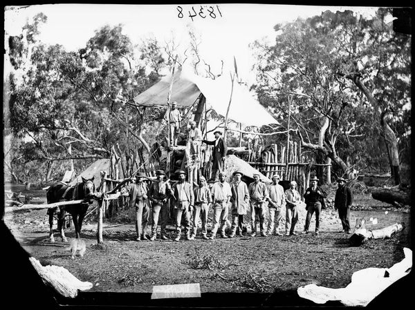 Gold miners pose at their mine with the Clerk of Petty Sessions, L.S. Donaldson and the flag indicating a strike, Gulgong area (1)