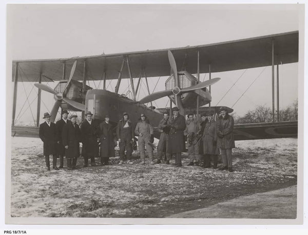 Group photograph taken in front of the Vickers Vimy on a snowy day at Hounslow, London 12/11/1919. In flying clothes, from left to right: Sir Ross Smith, Sir Keith Smith, Sergeant Bennett and Sergeant Shiers. The tall man between Bennett and Shiers in R.K. Pierson, the designer of the Vickers Vimy.