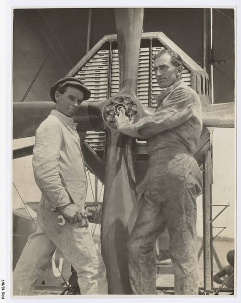 https://www.catalog.slsa.sa.gov.au:443/record=b3198017~S1  Mechanics Walter Shiers and James Bennett assessing the engine and propeller of the Vickers Vimy.