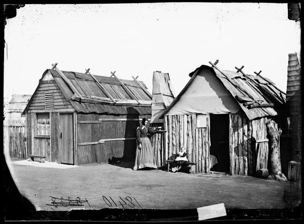 Louisa Lawson and her son Charles William in front of their bark hut, Gulgong area