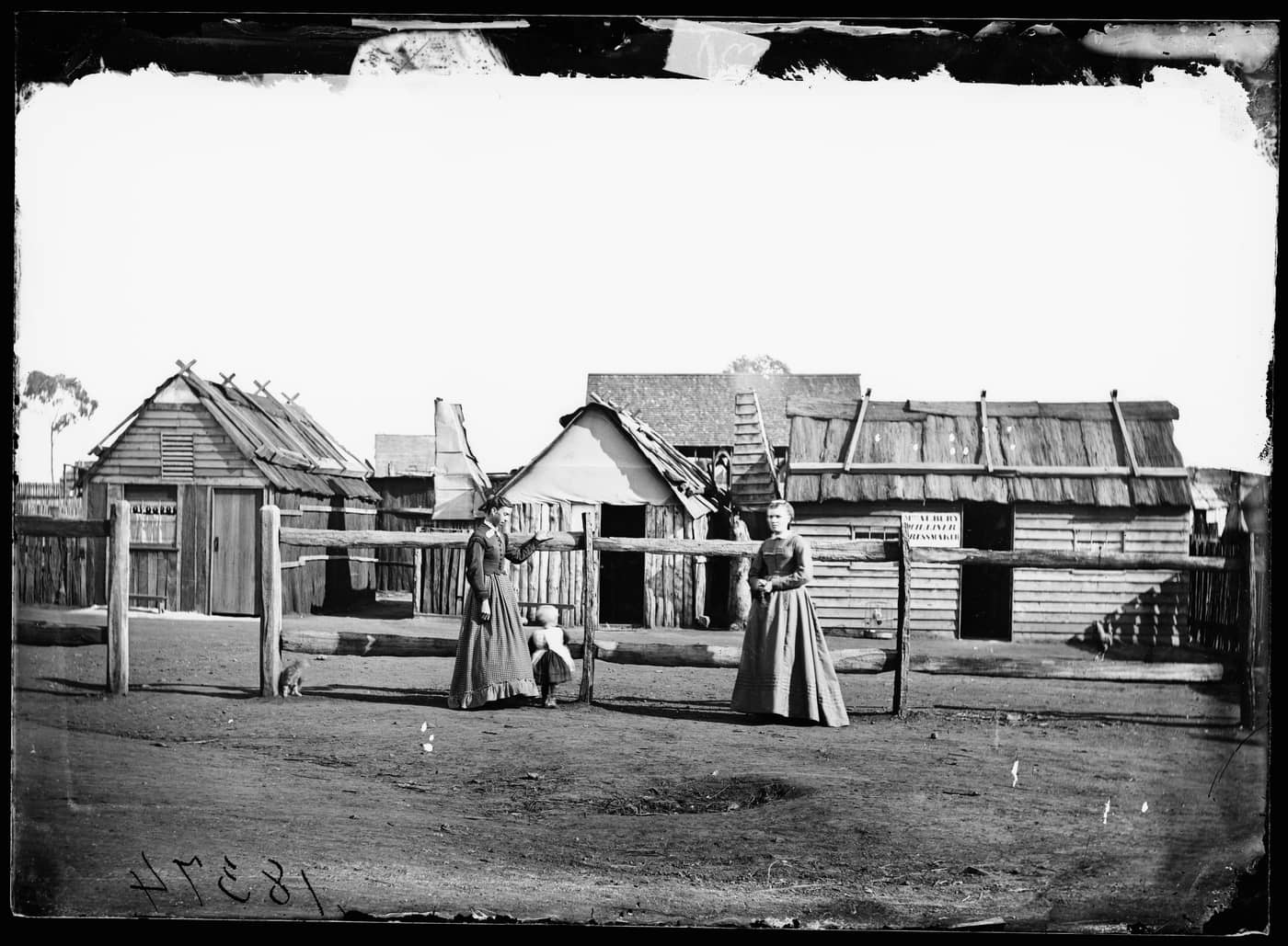 Louisa Lawson her son Charles William  and her sister Phoebe Albury outside Mrs. Albury's dressmaking shop Gulgong area Mitchell Library, State Library of New South Wales