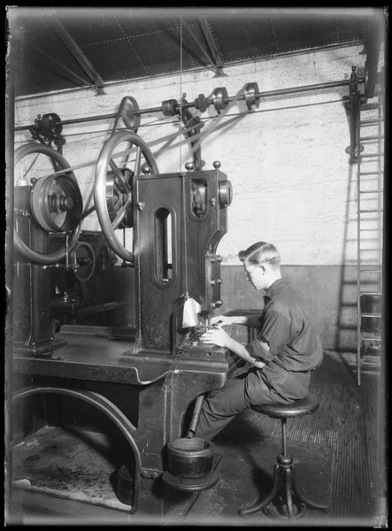 Man working a coin press at the Sydney Mint, Sydney, ca. 1920s