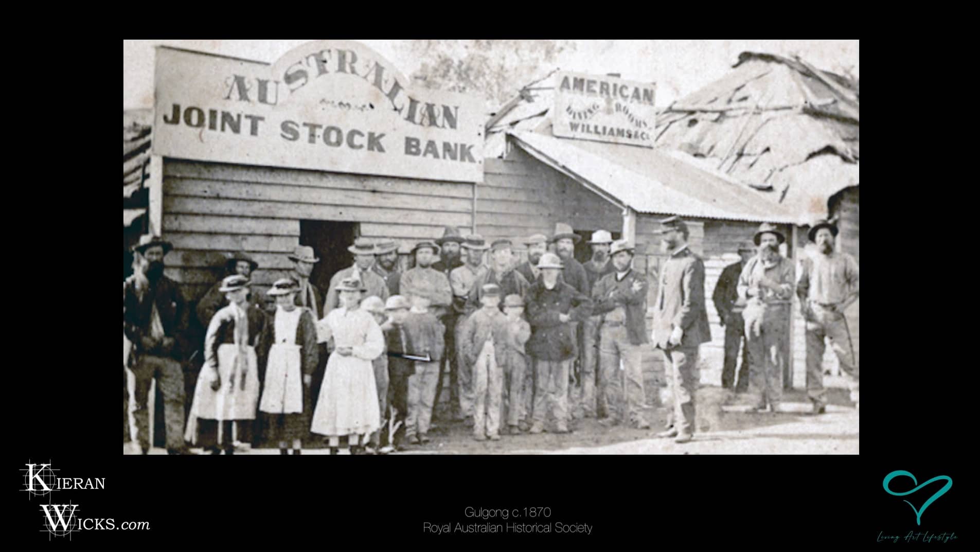 ONE TOWN AT A TIME EP 4 SCREENSHOT 18 - GULGONG NSW c1870 TOWNSFOLK STANDING IN FRONT OF AUSTRALIAN JOINT STOCK BANK - ROYAL AUSTRALIAN HISTORICAL SOCIETY