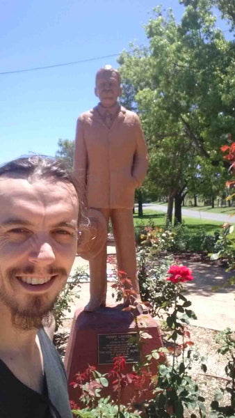 Kieran Wicks in front of Henry Lawson Statue in Gulgong NSW
