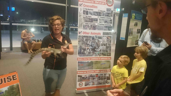 Crocodylus Park Darwin NT Promotional Exhibit small crocodile being held by presenter