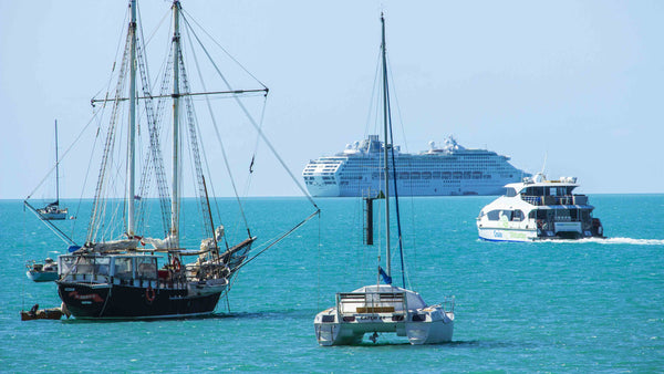 Ships anchored off tourist destination Airlie Beach Queensland. Cruise Ship, Pirate Ship, Luxury Yacht, Tinny. Paradise, Great Barrier Reef, Living Art Lifestyle