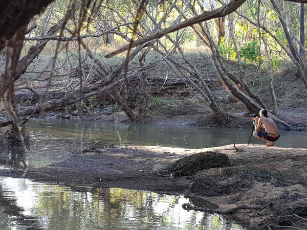 Kieran Wicks taking photos for One Town at a Time on the Banks of the creek at Walkers Crossing near Normanton QLD
