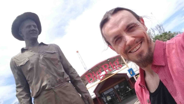Touring Musician Kieran Wicks next to The Driller Statue at The Big Rig Oil Museum in Roma QLD