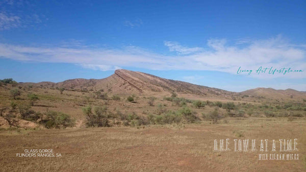 UFO  Disk shaped Red dirt mountain in Outback South Australia dirt road in Glass Gorge, Flinders Ranges, South Australia. Desoloute scene