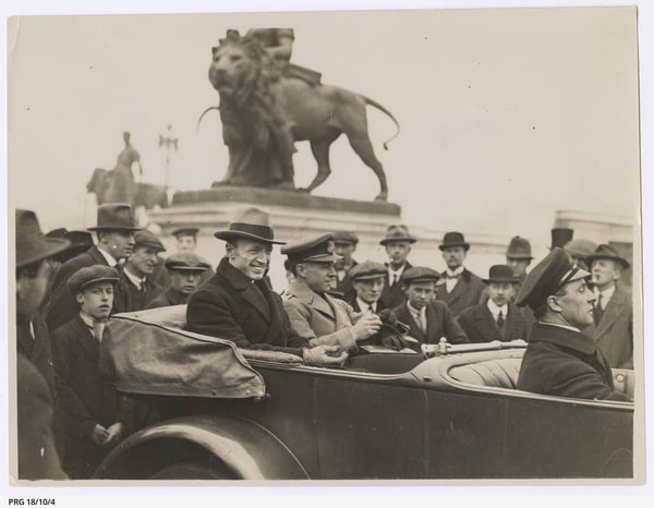 https://www.catalog.slsa.sa.gov.au:443/record=b3198818~S1  Ross and Keith Smith in a car outside Buckingham Palace, after Keith received his knighthood as a member of the Order of the British Empire (K.B.E.) from King George V, in recognition of the England-Australia flight. A crowd of well-wishers is gathered around the car.
