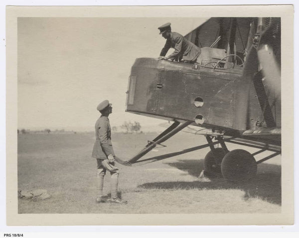 Ross and Keith Smith with the Vickers Vimy - PRG-18-8-4 - https://www.catalog.slsa.sa.gov.au:443/record=b3198014~S1  Ross and Keith Smith at the nose of the Vickers Vimy, after landing in Sydney, New South Wales. Photograph by Walter Burke, Challis House, Sydney.