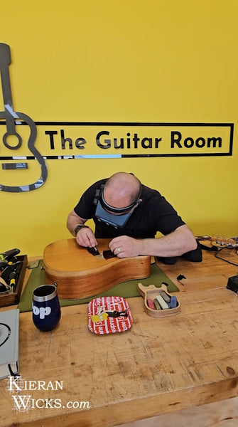 Luthier Rod McCracken measuring action on Kieran Wicks' Cole Clark Guitar Fat Lady 2 at The Guitar Room - Kilmore Victoria