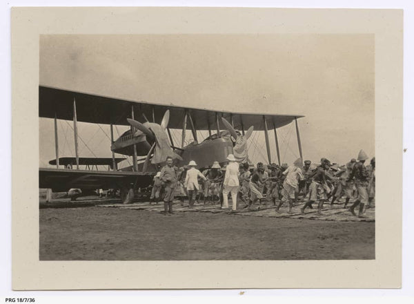 https://www.catalog.slsa.sa.gov.au:443/record=b3197880~S1  Natives towing the Vickers Vimy along bamboo matting track at Surabaya, Indonesia, 7/12/1919.