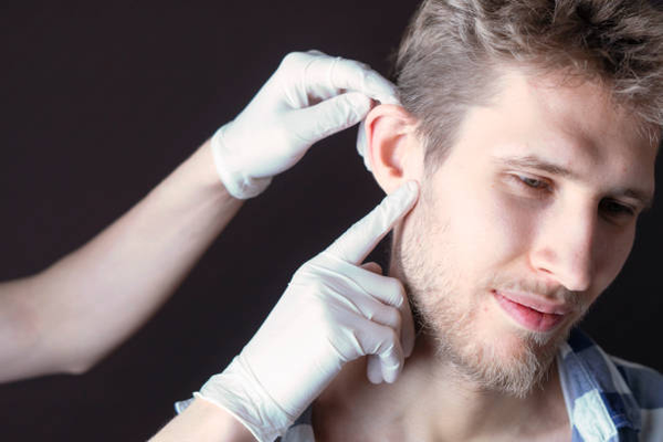 A person seeking professional help for ear wax removal