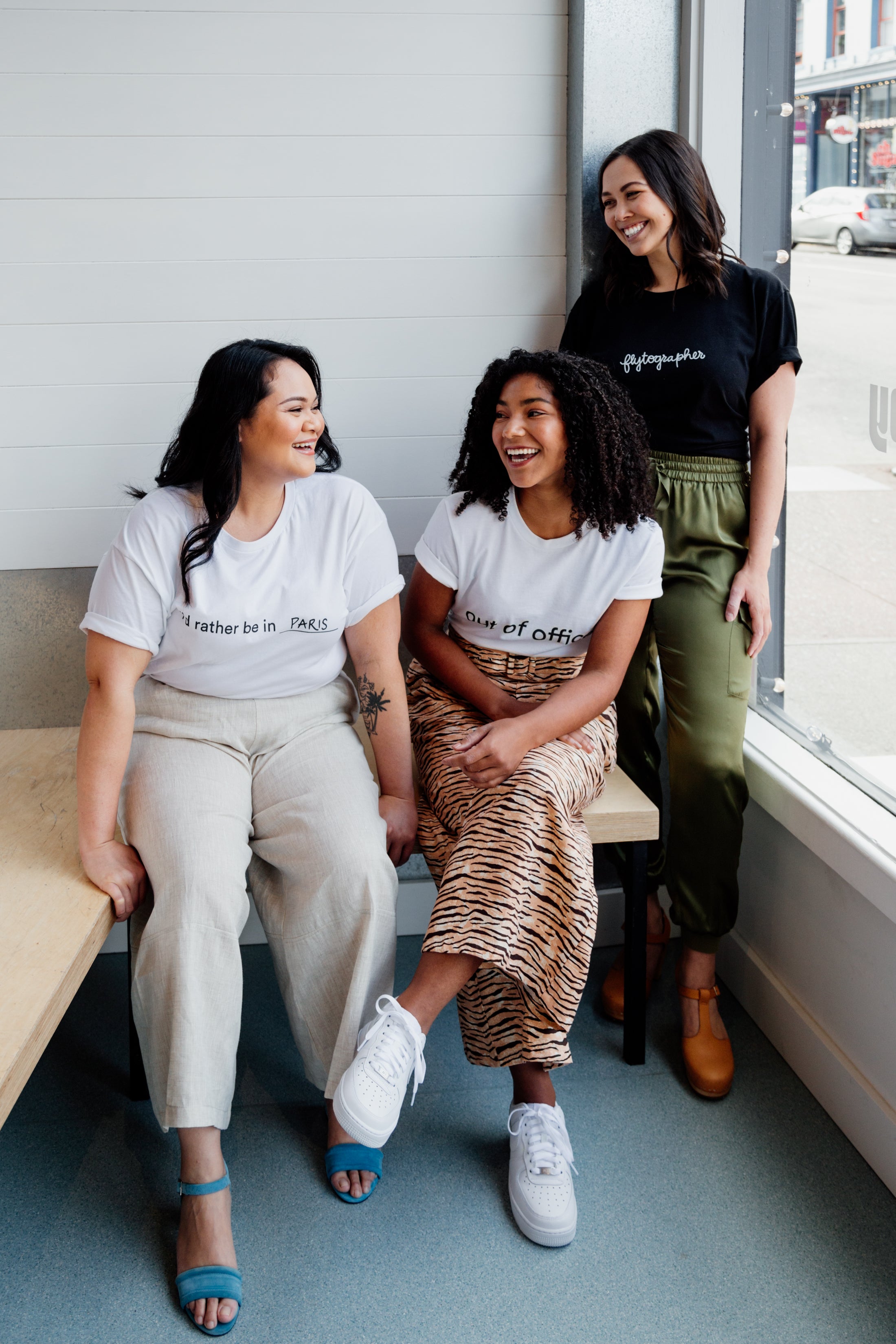 Three women pose for Flytographer Travel Shop.