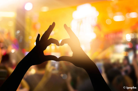 Love heart with hands at a festival