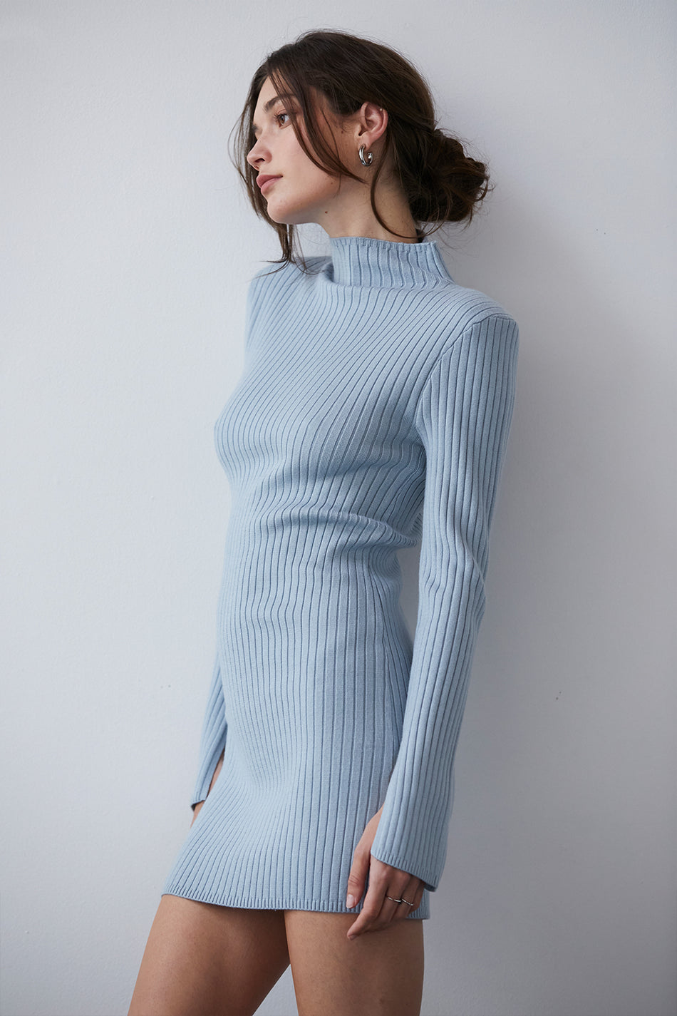 model wearing a blue sweater dress