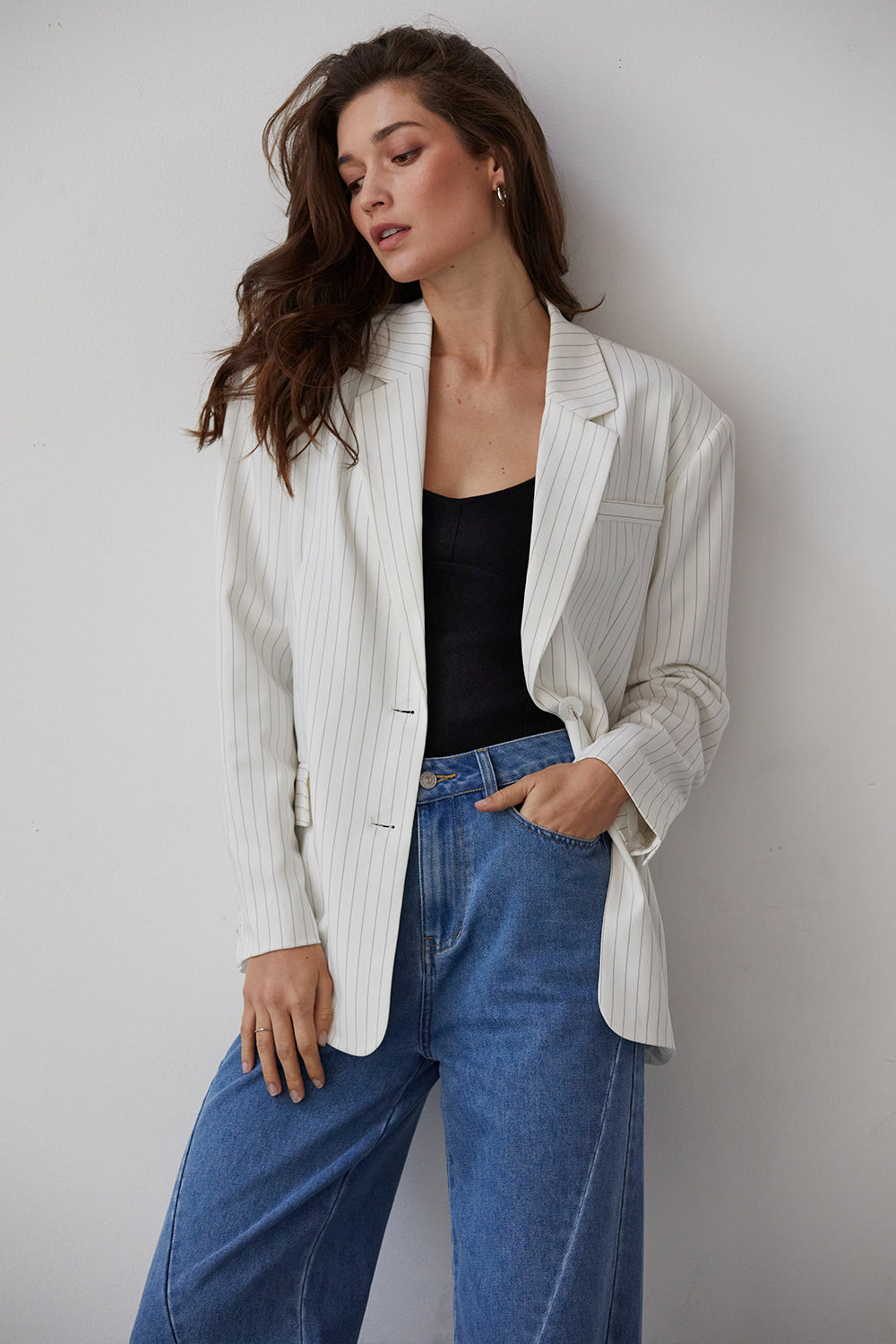 model wearing a pinstriped oversized blazer