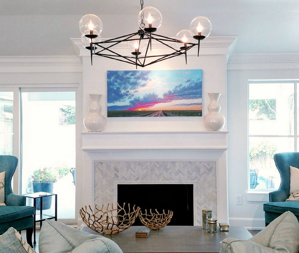 Sunset painting over fireplace