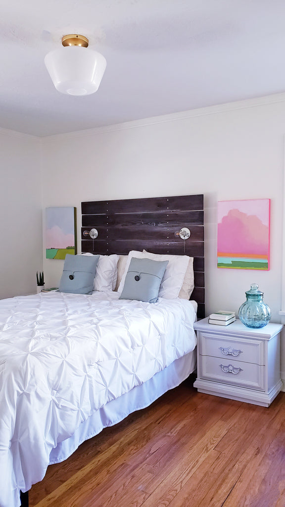 Paintings above bedside table