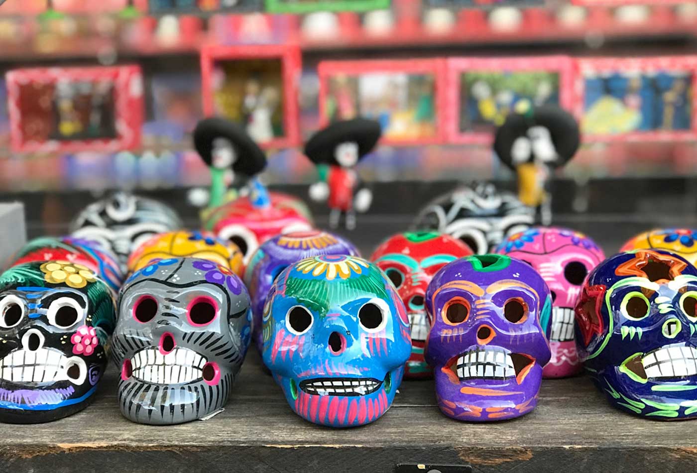 shows an image of day of the dead heads in a shop