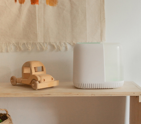 Canopy Nursery Humidifier on shelf with toys