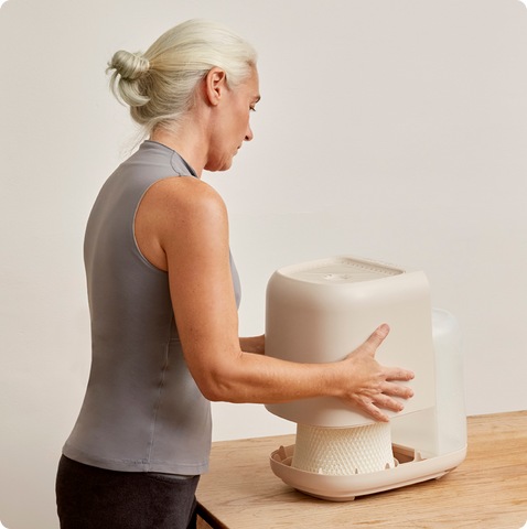 Woman setting up Canopy humidifier