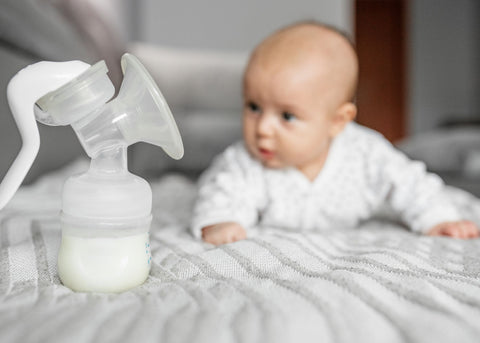Baby with breast pump