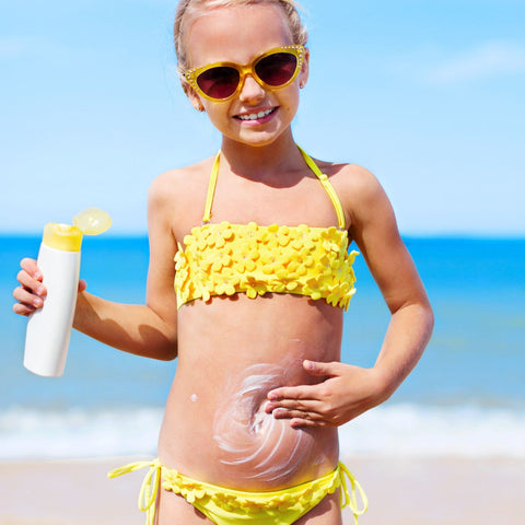 Girl applying sunscreen