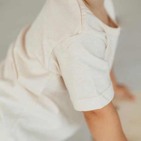 closeup of the creamy color and speckled texture of the everyday organic cotton kids tee