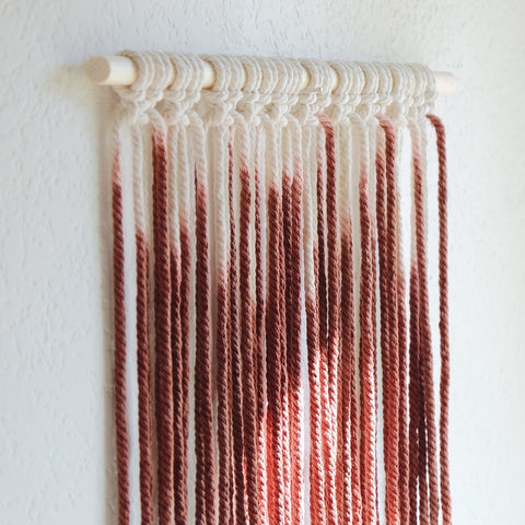 side view of dip dyed macrame wall hanging