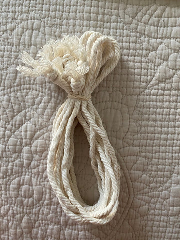 macrame cord bundle tied with rubber band