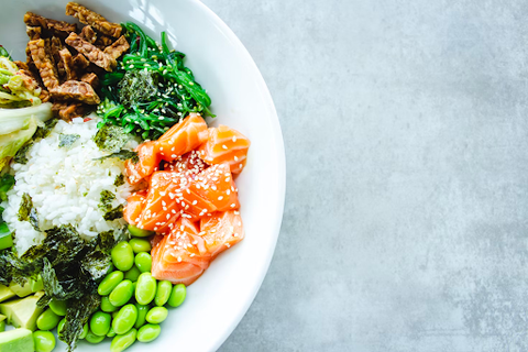  A bowl full of rice, healthy proteins, and vegetables