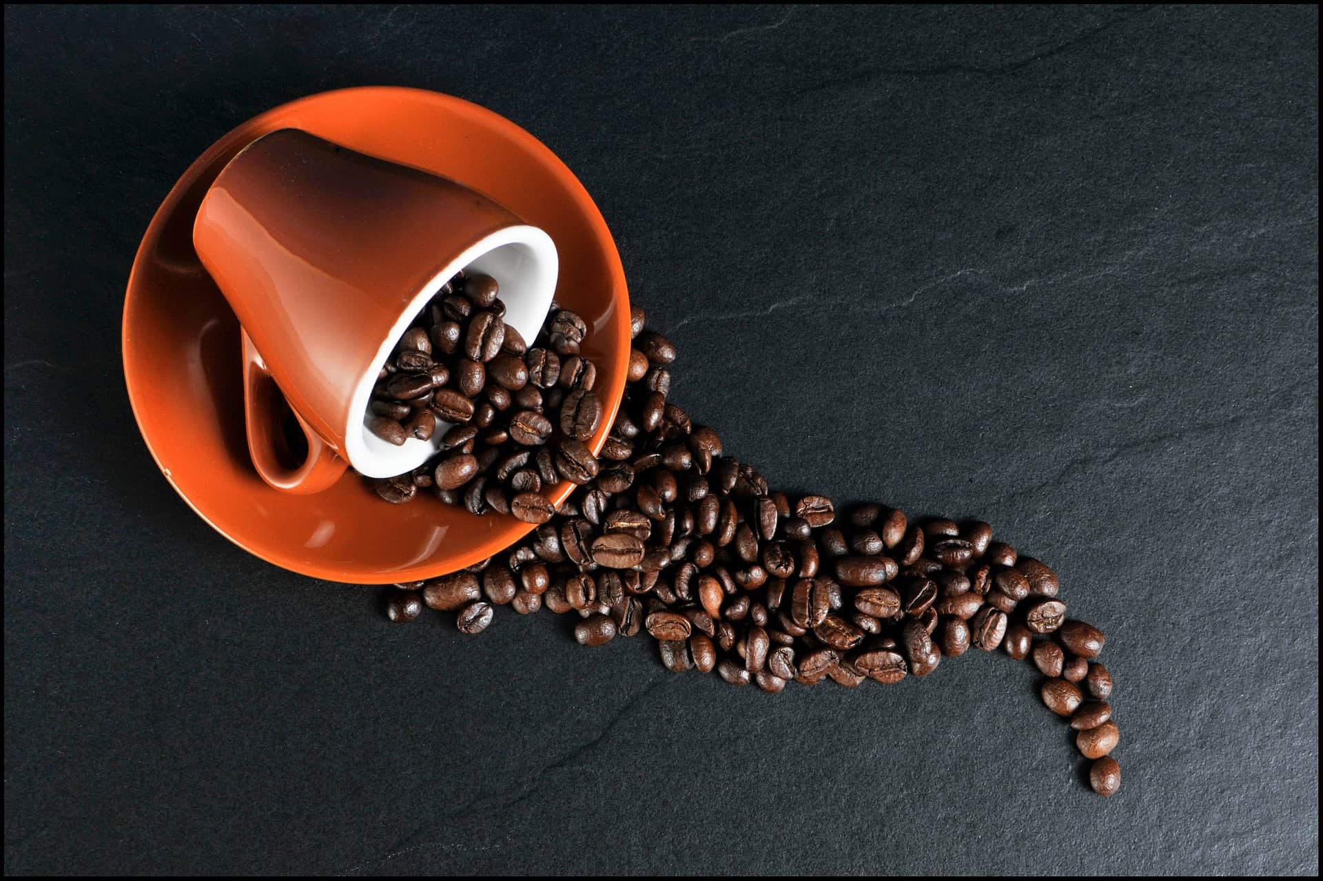 Coffee beans in coffee cup